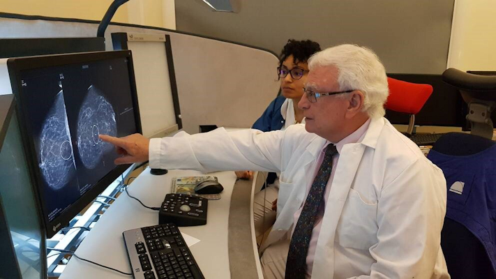 Dr. Laszlo Tabar in action by his breast imaging PACS workstation