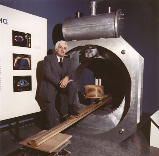 Dr. Raymond Damadian with the machine he named "Indomitable" at the Smithsonian Institution Exhibit in 1986. Image courtesy of Fonar